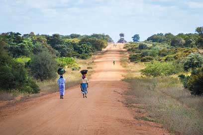 African-Women-Walking-Along-Road   Sand-Road-To-Mapai Picture