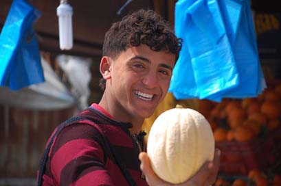 Tunisia Market Boy Melon Picture